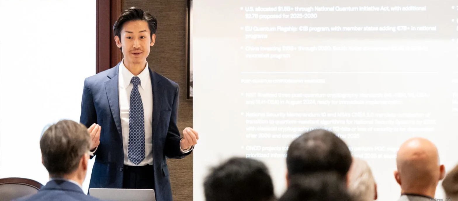 A BTQ speaker presenting quantum security research to an audience at an industry briefing